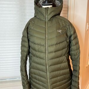 Arcteyx down-filled hoodie in dark khaki green.